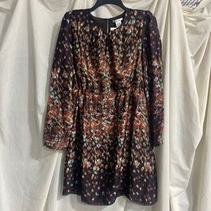 Beautiful brown pattern dress. Looks like silk but is not. NWT. Front Opening.
